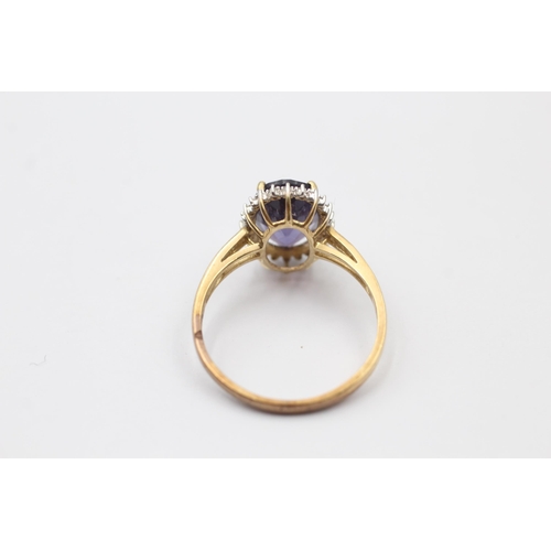 1113 - A 9ct gold amethyst and diamond halo dress ring - approx. gross weight 2.7 grams