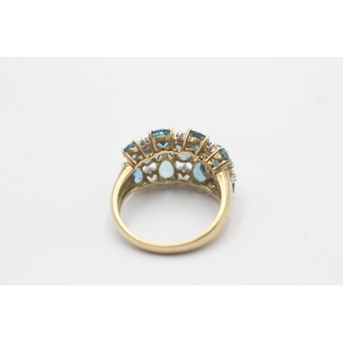 1123 - A 9ct gold blue topaz and diamond stylised cluster dress ring, size P½ - approx. gross weight 4.3 gr... 