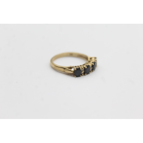 1124 - A 9ct gold sapphire and diamond gypsy setting ring - approx. gross weight 2 grams