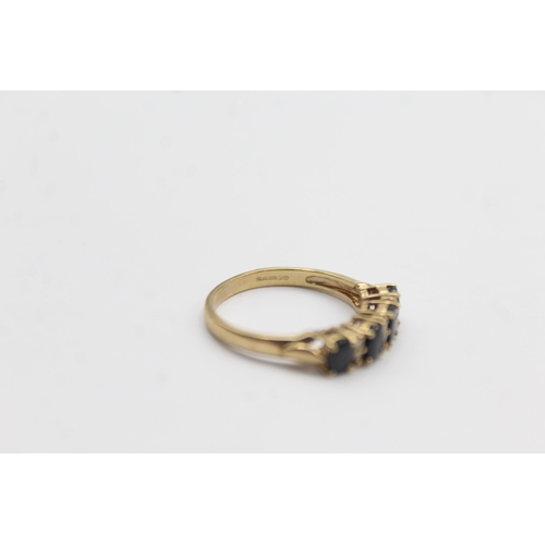 1124 - A 9ct gold sapphire and diamond gypsy setting ring - approx. gross weight 2 grams