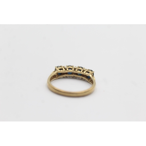 1124 - A 9ct gold sapphire and diamond gypsy setting ring - approx. gross weight 2 grams