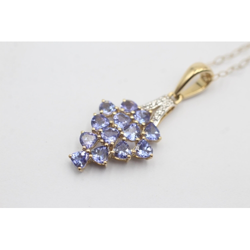 1127 - A 9ct gold tanzanite and diamond cluster pendant necklace - approx. gross weight 2.4 grams