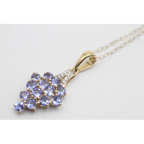 1127 - A 9ct gold tanzanite and diamond cluster pendant necklace - approx. gross weight 2.4 grams