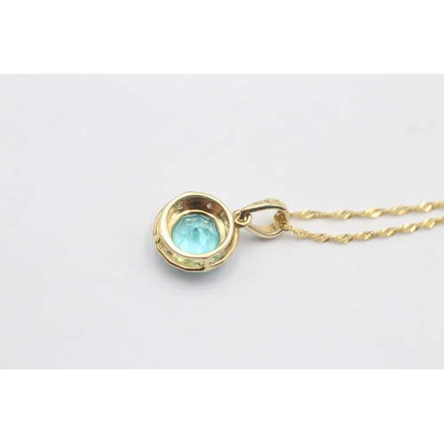 1129 - A 9ct gold coated blue topaz and diamond halo pendant necklace - approx. gross weight 1.4 grams