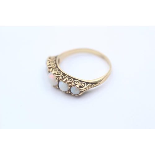 1130 - A 9ct gold opal five stone gypsy setting ring, size M - approx. gross weight 2.4 grams