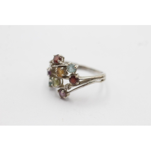 1131 - A 9ct white gold garnet, amethyst, citrine, topaz, peridot and diamond stylised floral ring - approx... 