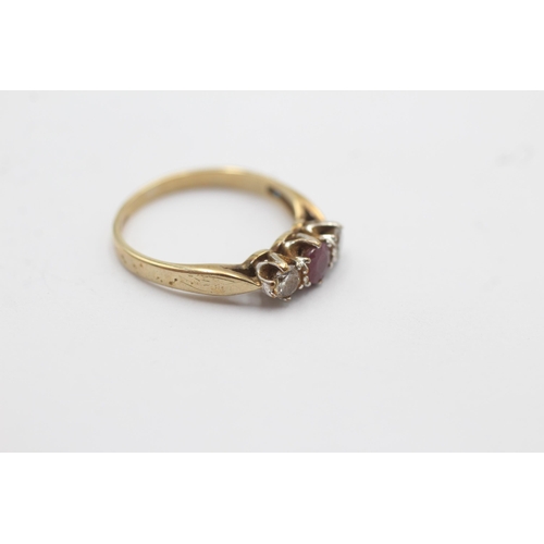 1136 - A 9ct gold ruby and diamond trilogy dress ring - approx. gross weight 1.6 grams