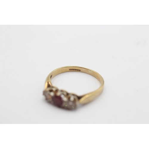 1136 - A 9ct gold ruby and diamond trilogy dress ring - approx. gross weight 1.6 grams