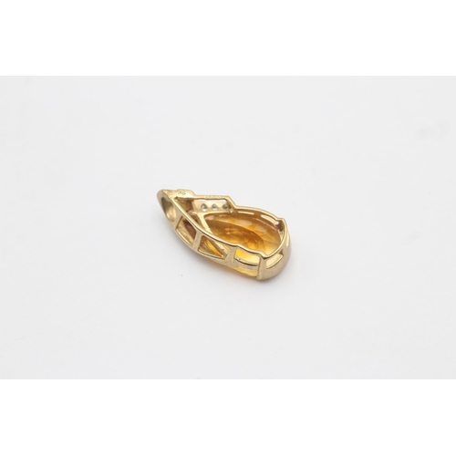 1141 - A 9ct gold diamond and citrine pendant - approx. gross weight 1.9 grams