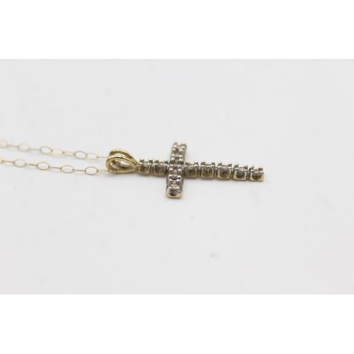 1143 - A 9ct gold diamond set cross pendant necklace - approx. gross weight 1.4 grams and 23cm long when fa... 