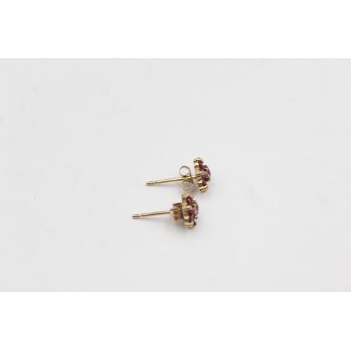 1147 - A pair of 9ct gold ruby star cluster earrings - approx. gross weight 0.6 grams