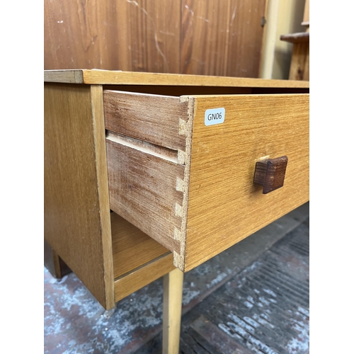 91 - A mid 20th century oak dressing table with four drawers