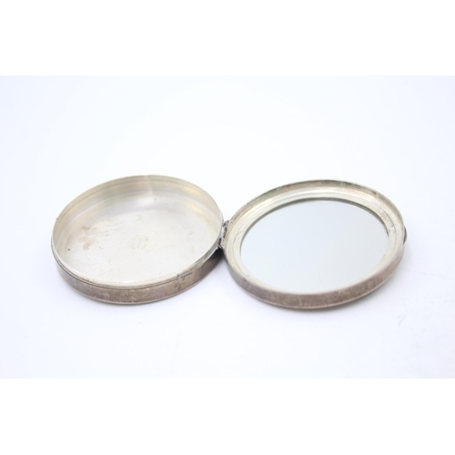 1276 - Two hallmarked sterling silver ladies' vanity compacts - approx. gross weight 67 grams