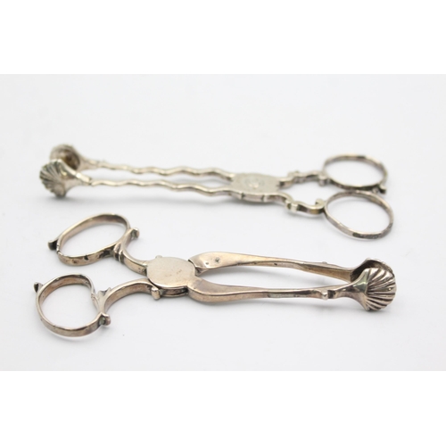 1303 - Two pairs of hallmarked silver sugar tongs - approx. gross weigh 55 grams