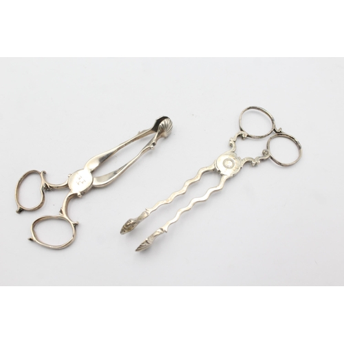 1303 - Two pairs of hallmarked silver sugar tongs - approx. gross weigh 55 grams