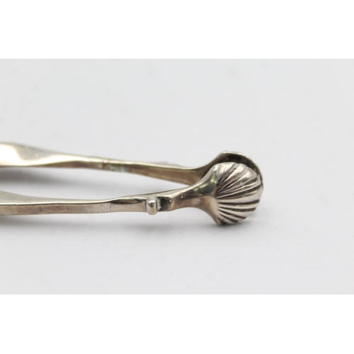 1303 - Two pairs of hallmarked silver sugar tongs - approx. gross weigh 55 grams