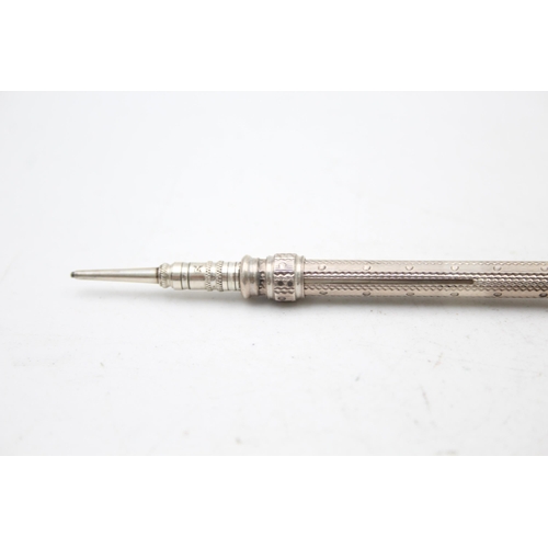 1307 - Two silver propelling pencils, one .880 and one .925 - approx. gross weight 25 grams