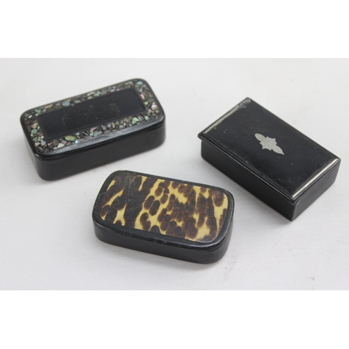 1333 - Three 19th century papier-mâché snuff boxes to include mother of pearl inlaid etc.