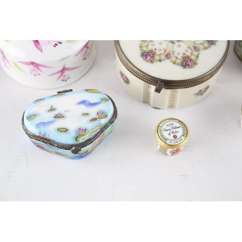 257 - A collection of ceramic and enamel trinket/pill boxes to include Halcyon Days etc.