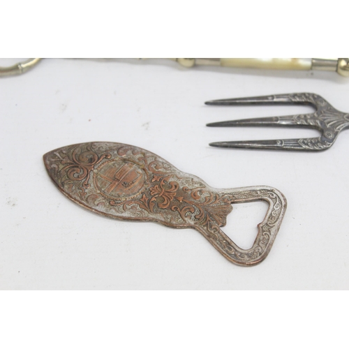 333 - Six pieces of antique and vintage kitchenware to include silver plated bread fork, bottle opener etc... 