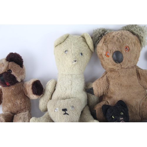 359 - Eight vintage stuffed toys to include hand puppet, mohair etc.