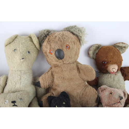 359 - Eight vintage stuffed toys to include hand puppet, mohair etc.