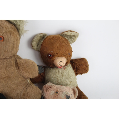 359 - Eight vintage stuffed toys to include hand puppet, mohair etc.