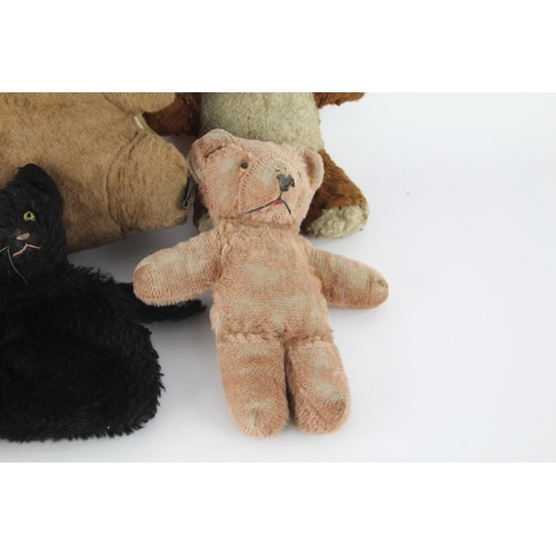 359 - Eight vintage stuffed toys to include hand puppet, mohair etc.