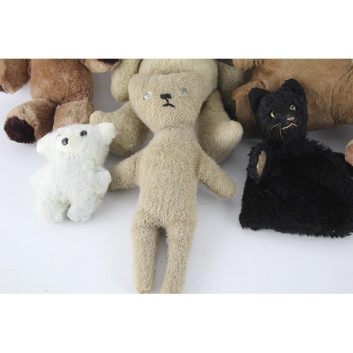 359 - Eight vintage stuffed toys to include hand puppet, mohair etc.