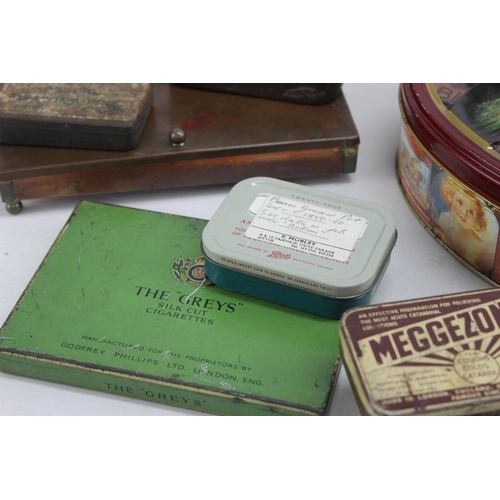 439 - A collection of vintage collectable tins to include Royal, Basset's etc.