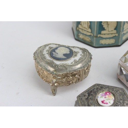 440 - A collection of vintage storage boxes to include mother of pearl trinket box etc.