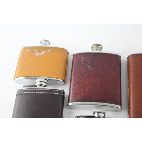 464 - A collection of vintage hip flasks to include leather, pewter etc.