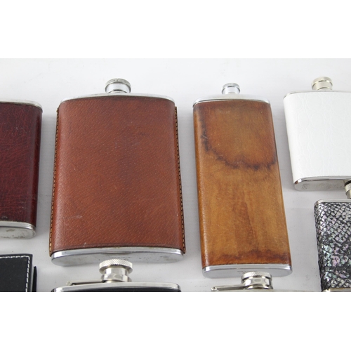 464 - A collection of vintage hip flasks to include leather, pewter etc.