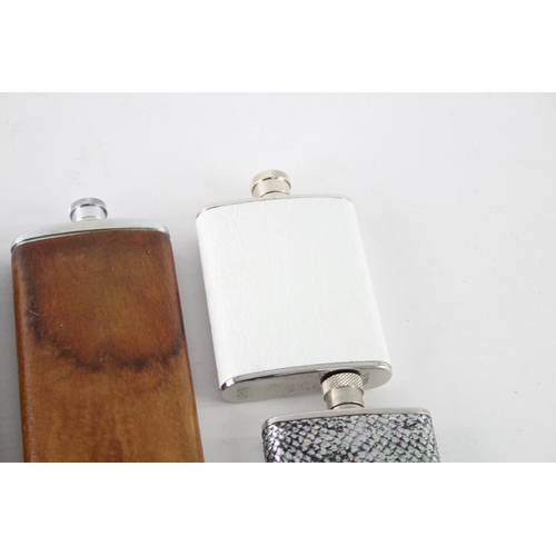 464 - A collection of vintage hip flasks to include leather, pewter etc.