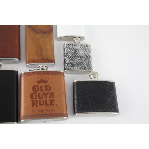 464 - A collection of vintage hip flasks to include leather, pewter etc.