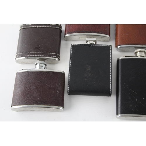 464 - A collection of vintage hip flasks to include leather, pewter etc.