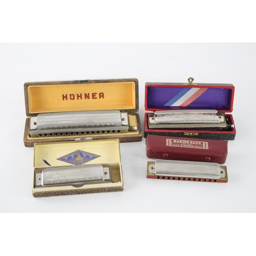 487 - Four vintage boxed M. Hohner harmonicas