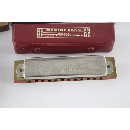 487 - Four vintage boxed M. Hohner harmonicas