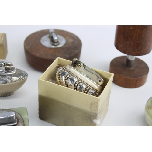 488 - A collection of vintage table lighters to include Ronson etc.