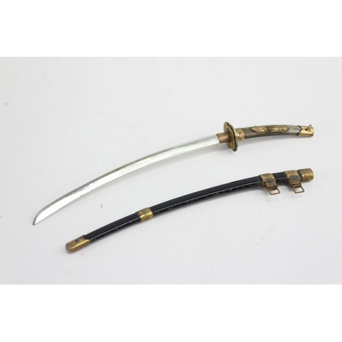 490 - Two vintage novelty sword letter openers