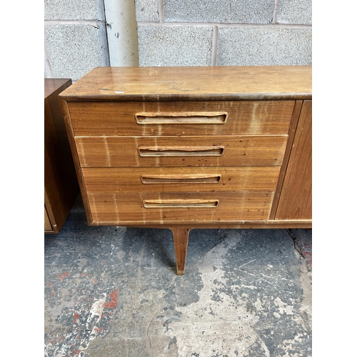 10 - A 1960s G Plan teak sideboard with four drawers and two cupboard doors