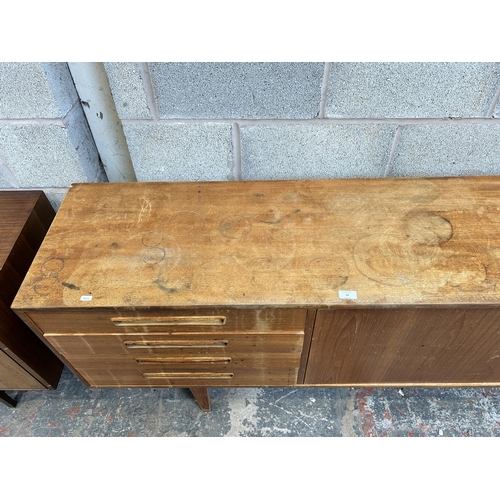 10 - A 1960s G Plan teak sideboard with four drawers and two cupboard doors