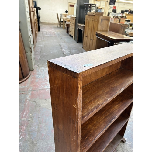 103 - A mid 20th century stained oak four tier bookcase