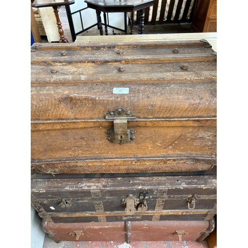 107 - Three early 20th century travel trunks