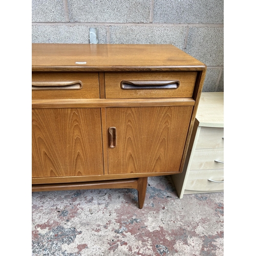 11 - A 1960s G Plan Fresco teak sideboard with three drawers and four cupboard doors