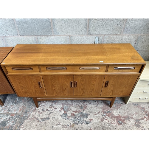 11 - A 1960s G Plan Fresco teak sideboard with three drawers and four cupboard doors