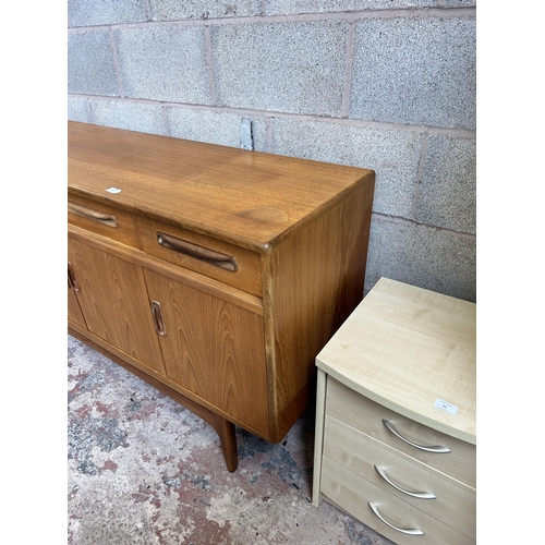 11 - A 1960s G Plan Fresco teak sideboard with three drawers and four cupboard doors