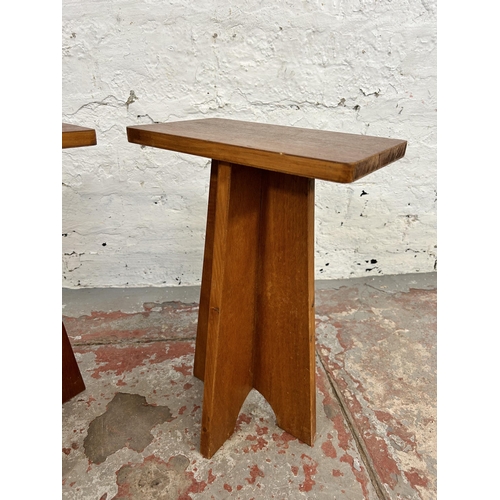 110 - A pair of mid 20th century teak side tables