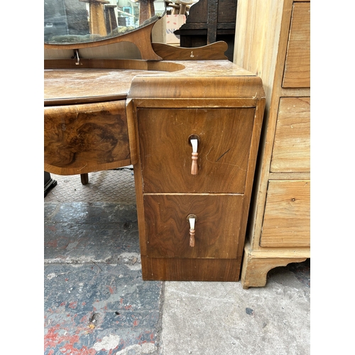 121 - An Art Deco style walnut dressing table with five drawers and upper mirror