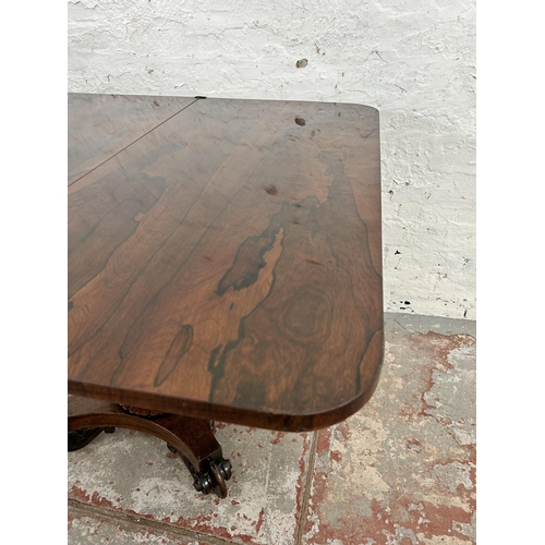 127 - A William IV rosewood fold over tea table on quatrefoil base